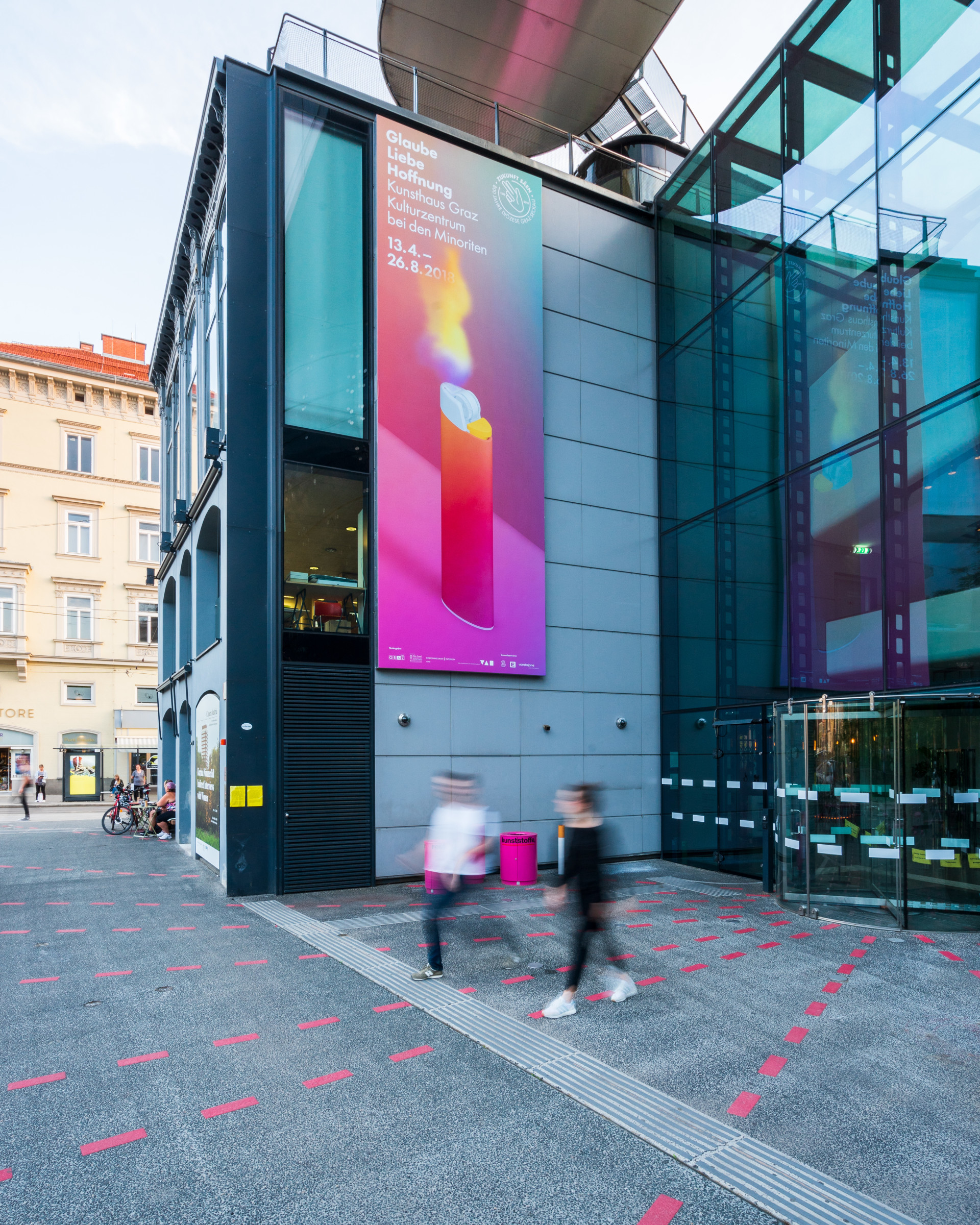 The Kunsthaus from the outside with large exhibition poster hanging from the facade