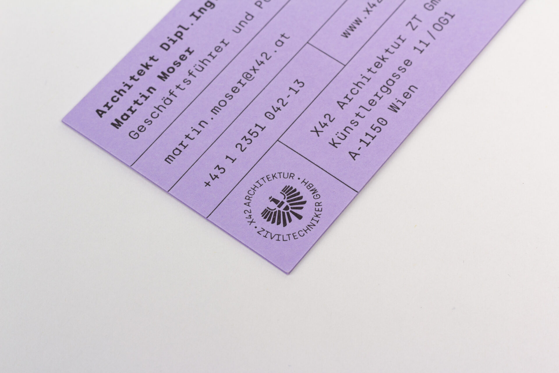 Detail shot of the business card on purple paper